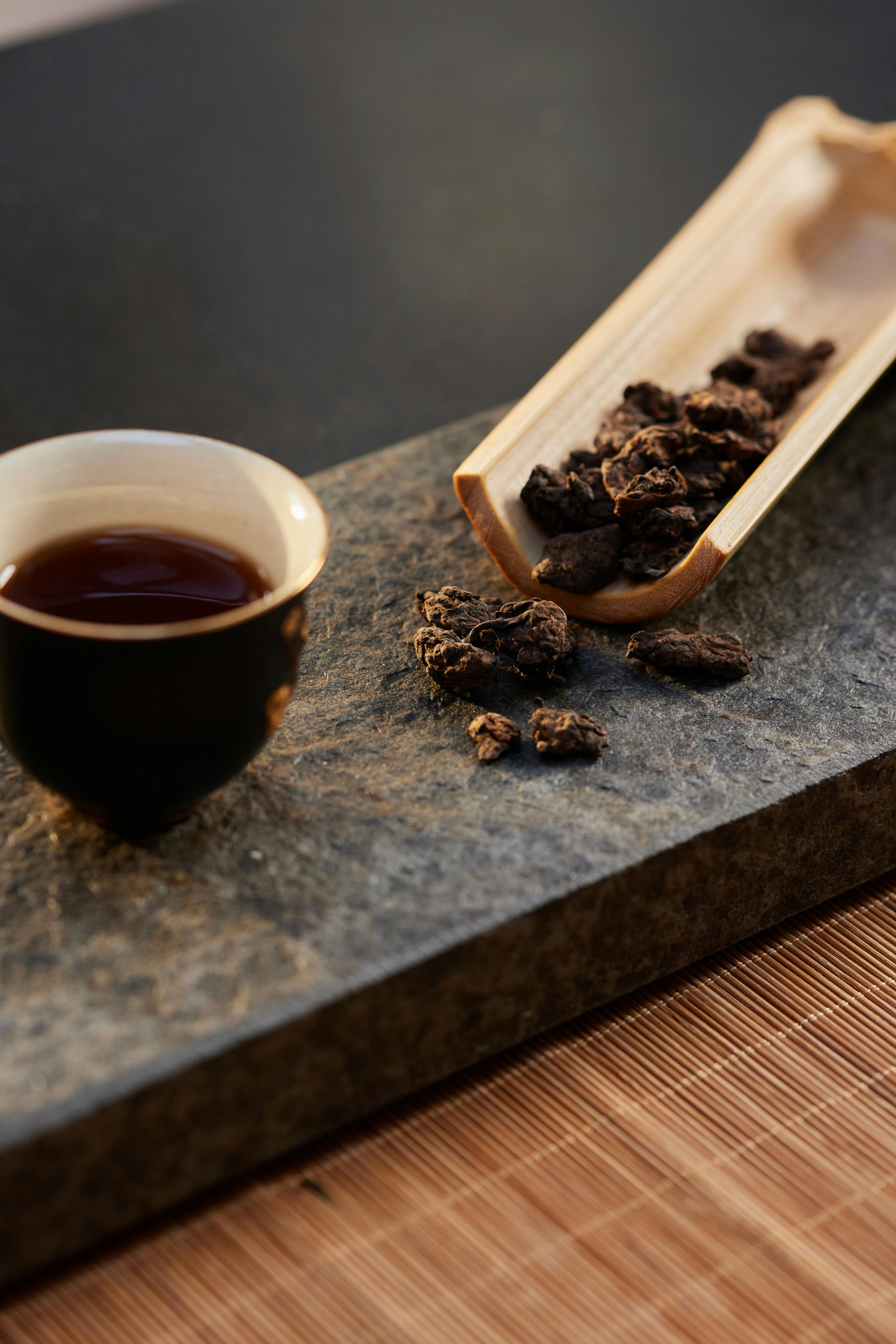 A serene tea ceremony setup with ceramic teapot and cups